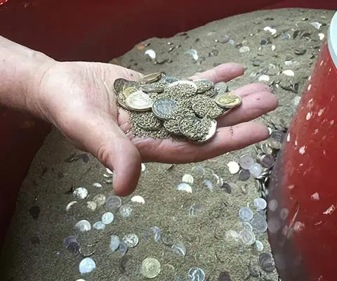 Coins in a vibratory finishing machine